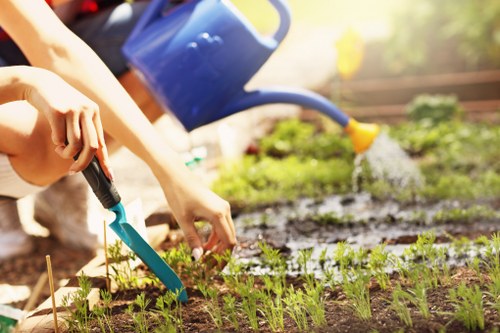 Technician preparing hedge trimming paperwork for secure payment